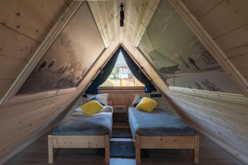 a room with two beds in a attic at Wierchowe Zacisze in Bukowina Tatrzańska