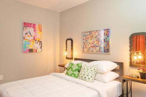 a bedroom with a white bed with pillows on it at Sky Walk at The Hillside in Newark