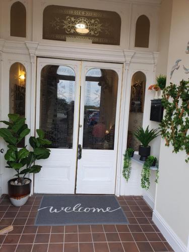 a welcome mat in front of a front door at Manhattan Lodge in Lytham St Annes