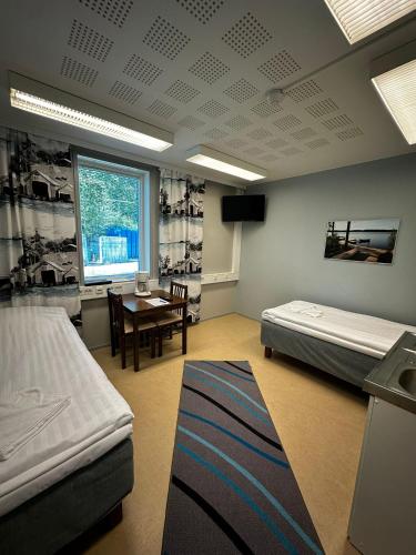 Katil atau katil-katil dalam bilik di Jääskän Loma Hostelli Antin Tupa