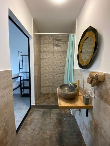 a bathroom with a sink and a shower at Sea Side in Vama Veche