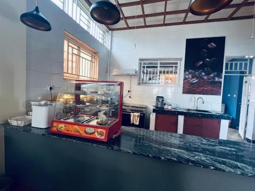 a kitchen with a counter with a fish tank on it at Elly Villa Hotel in Moshi