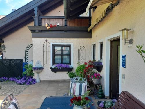 a house with flowers on the side of it at Ferienhaus Resch in Laufen