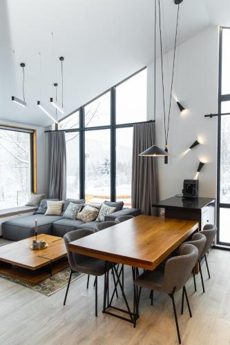 a living room with a couch and a table at INOclub in Tatariv