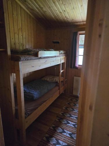 a small room with two bunk beds in it at Utsikten in Geilo