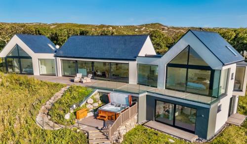 an aerial view of a house with glass at Brandy & Soda House in Roundstone