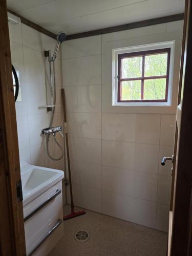 a bathroom with a sink and a window at Utsikten in Geilo