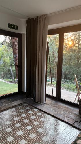 an empty room with sliding glass doors with a view at Avaluna 6 osobe max - shower outside tus spolja in Vrčin