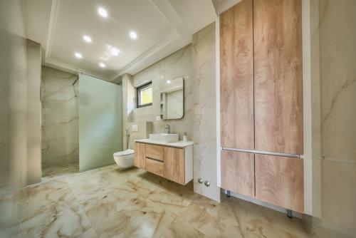 a bathroom with a sink and a toilet at Villa Tivat in Tivat