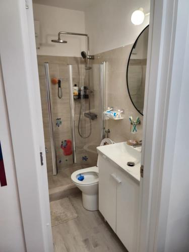 a bathroom with a shower and a toilet and a sink at Gara De Nord 3 Rooms Apartment Superb City View in Bucharest
