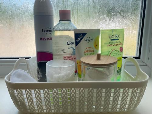 a basket filled with products sitting in a window at The Meadow Garden Guest Room in Newmarket