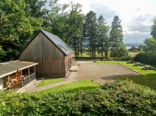 an overhead view of a barn with a yard at Birchwood Guest Lodge in Balmaha