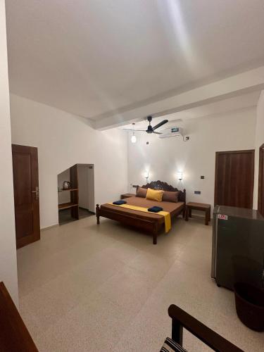 Una cama o camas en una habitación de Harmony Beach Hotel