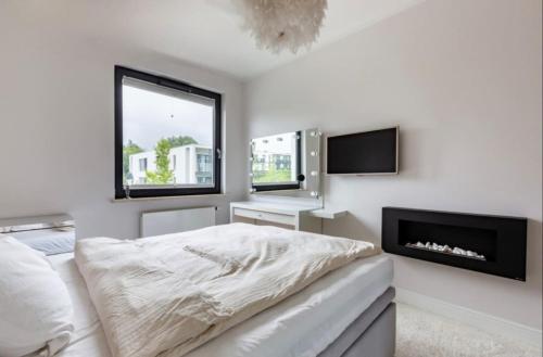 Ένα ή περισσότερα κρεβάτια σε δωμάτιο στο Luxury Apartment By The Beach