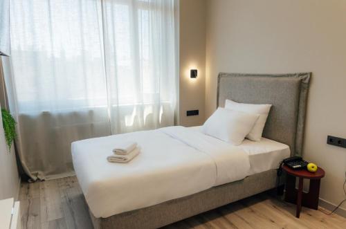 Postel nebo postele na pokoji v ubytování Aparthotel Aurum