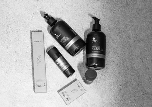 a pile of products sitting on the floor with a bottle at ASTREA Relax Suites in Adamas