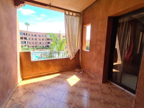 a room with a large window and a tile floor at Palm river marrackech in Marrakesh