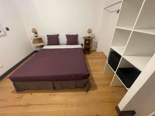 a bedroom with a bed and a book shelf at Villa de luxe Piscine 5 chambre in Vescovato