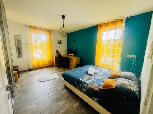 a bedroom with a bed and a desk in it at Villa Exclusive in Strasbourg