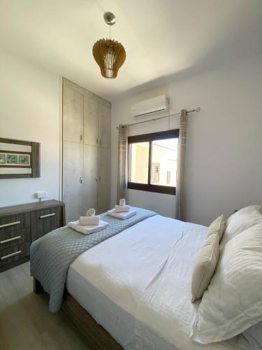 Ένα ή περισσότερα κρεβάτια σε δωμάτιο στο STAY Nest in Tala Apartment