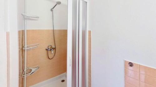 a bathroom with a shower with a glass door at Casa-Le Toussiard apart dans chalet St-Véran 4-6p in La Chalp-Sainte-Agathe