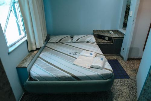 Giường trong phòng chung tại Andorinha Hotel (Adults Only)