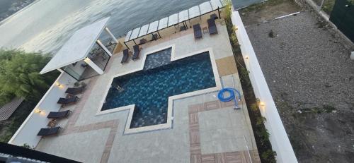 an overhead view of a swimming pool in a building at Harmony House - Adults Only in Dubova