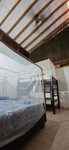 a bed in a tent in a room at Indigo Palomino Beautiful House in Palomino