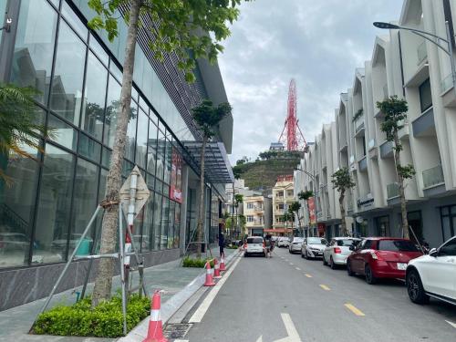 a street with cars parked on the side of the road at Green Diamon Luxury Apartment in Ha Long