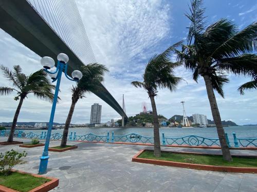 a view of the water and palm trees at Green Diamon Luxury Apartment in Ha Long