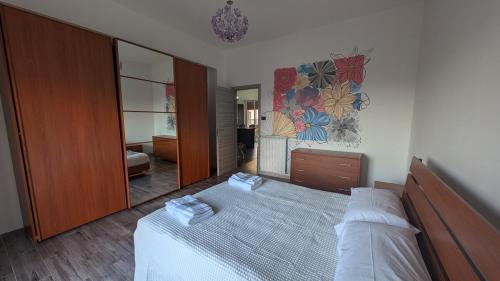 a bedroom with a bed and a large mirror at Casa Morgana, a 2 passi dal mare in Badolato Stazione