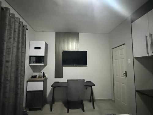 Телевизор и/или развлекательный центр в Mountain Drive Apartments