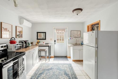 a kitchen with white appliances and a white refrigerator at Properties by Menjivar in Beverly