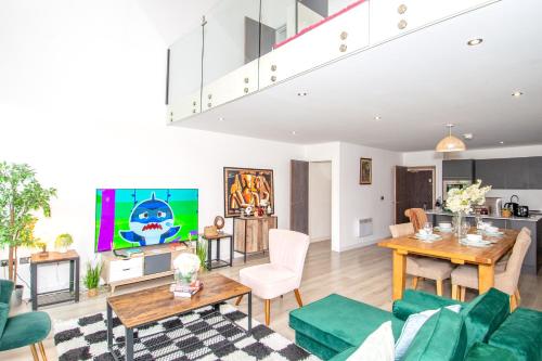 a living room with a couch and a table at 2BR Flat WiFi, Parking Contractors & Families in Bradford