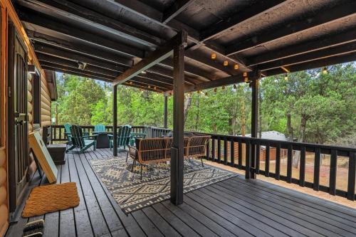 a wooden deck with a bench and tables on it at NEW! Hillside Getaway in the Pines, Games, Poker in Pine