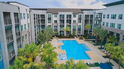 an aerial view of an apartment complex with a swimming pool at Blue Waves Serenity 1BD Lux King - Southeast Jax in Jacksonville