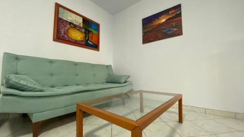 a living room with a couch and a glass table at Relax in Loutraki in Loutraki