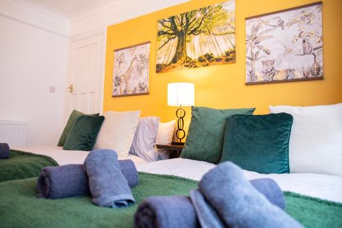 a bedroom with two beds with stuffed animals on them at Brighton & Hove, 4 bedrooms, 5 beds, Garage in Brighton & Hove