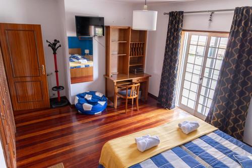 En eller flere senge i et værelse på Casa Looks