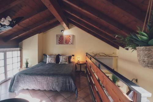 a bedroom with a bed in a room at Il fienile di Rosy in Ardenno