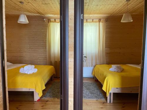 Postel nebo postele na pokoji v ubytování Mountain-View 3BR Wooden Cottage