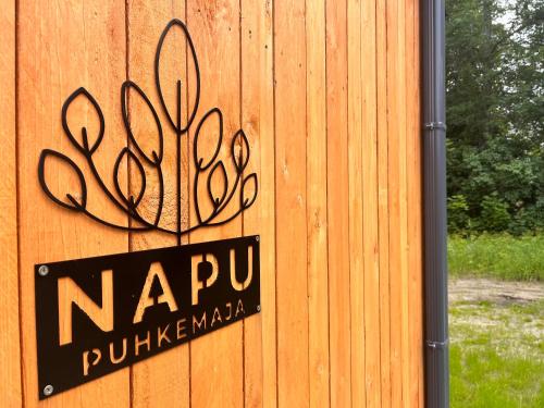 Napu Puhkemajaに飾ってある許可証、賞状、看板またはその他の書類