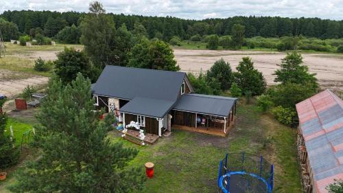 an aerial view of a house with a yard at Chatka Oli in Zubacze