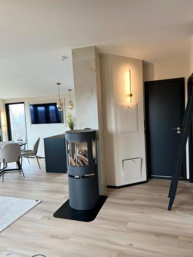 a living room with a trash can in the middle at High standard and beautiful view in Tennevika