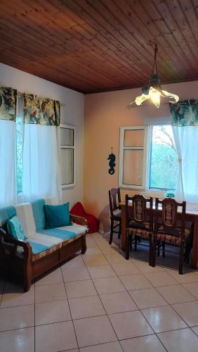 a living room with a couch and a table at Casa Nonna Traditional guest house in Oziás