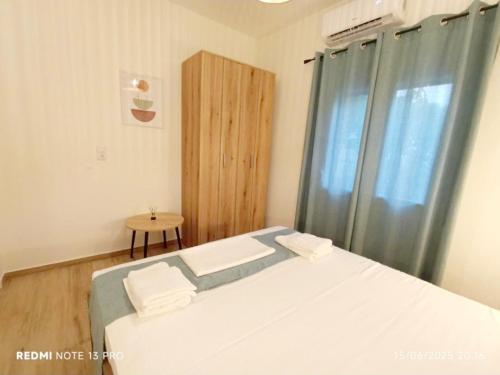 Кровать или кровати в номере Villa Laskarina