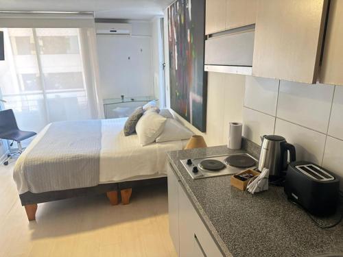 Ένα ή περισσότερα κρεβάτια σε δωμάτιο στο Apart hotel Fraga