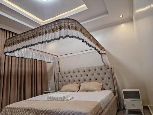 Katil atau katil-katil dalam bilik di Nyandungu Bright View Apartments