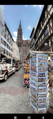 a display of items on a street in a city at logement 3 pièces à 10 minutes du célèbre marché de Noël de Strasbourg in Schiltigheim