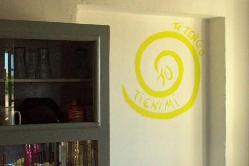a sign on a wall next to a cabinet at BB Dadaumpa in Novi Ligure